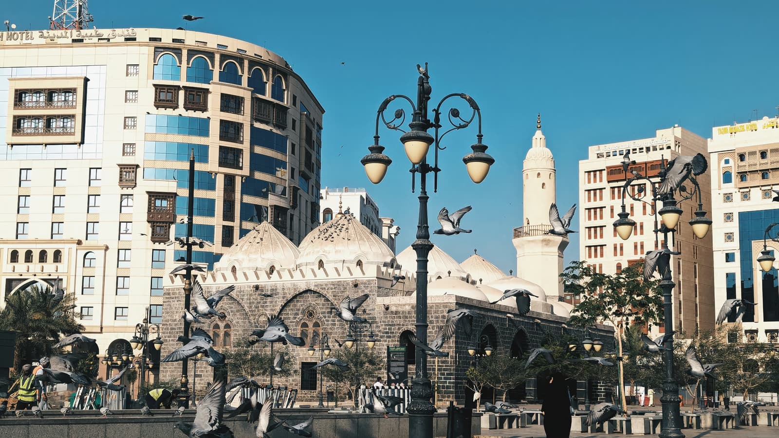 Masjid al-Ghamama in Madinah with pigeons in flight